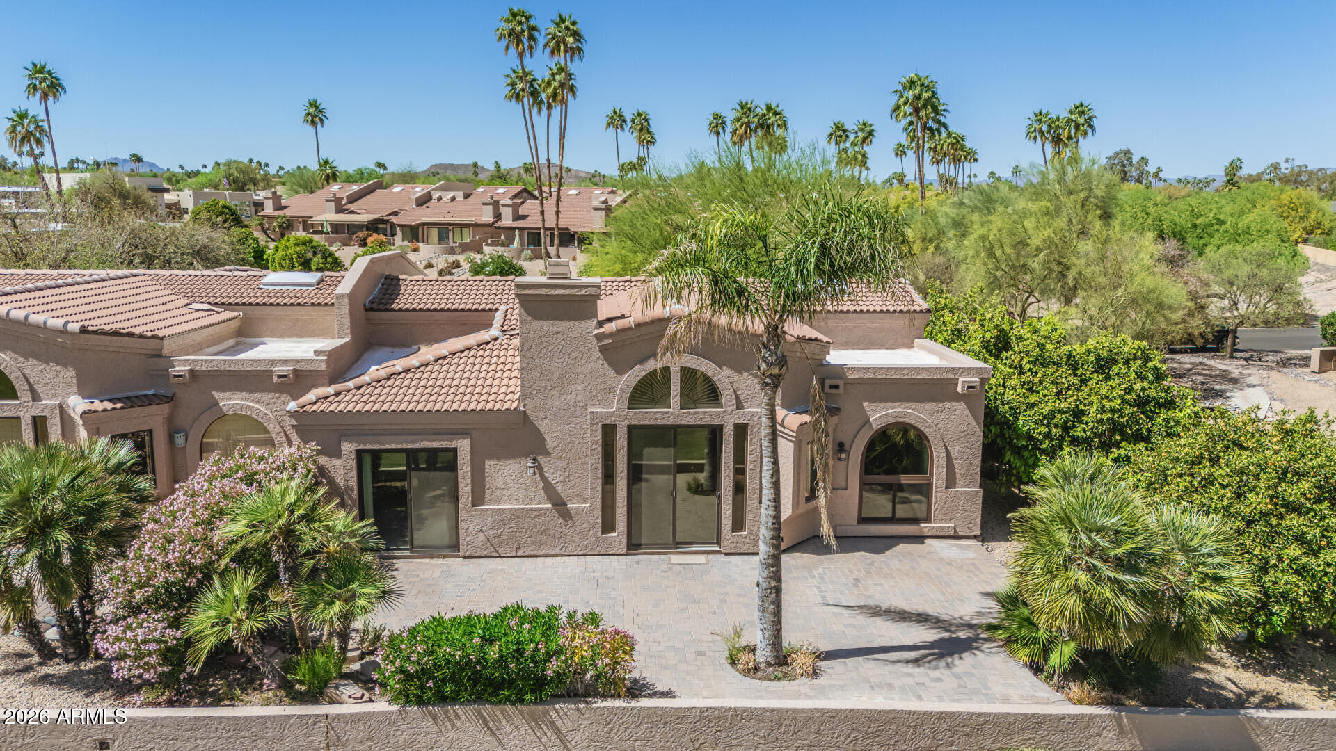 25615 North Bolero Bend, Unit 5 Rio Verde, AZ 85263 - Photo 6 of 57 a front view of a house with a yard and garage
