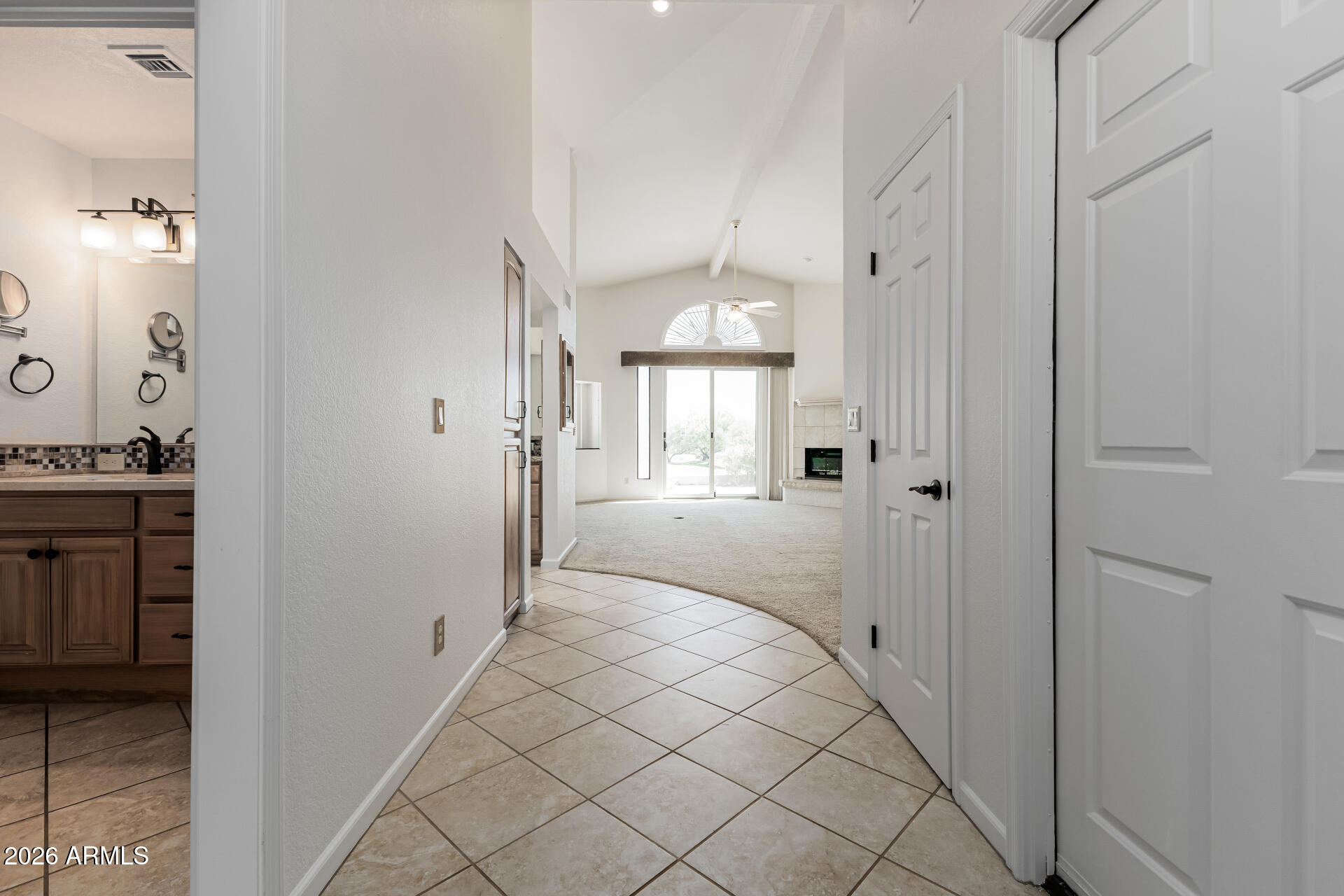 25615 North Bolero Bend, Unit 5 Rio Verde, AZ 85263 - Photo 10 of 57 a view of a hallway with wooden floor windows and a bathroom