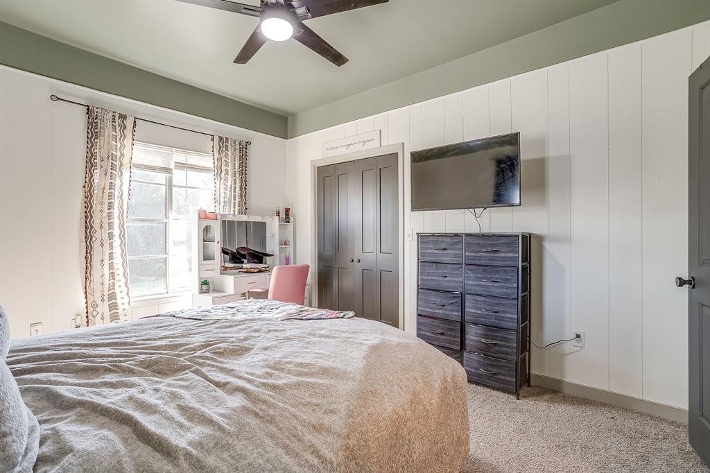 610 North Mesquite Hico, TX 76457 - Photo 22 of 34 a bedroom with a bed and a flat tv screen