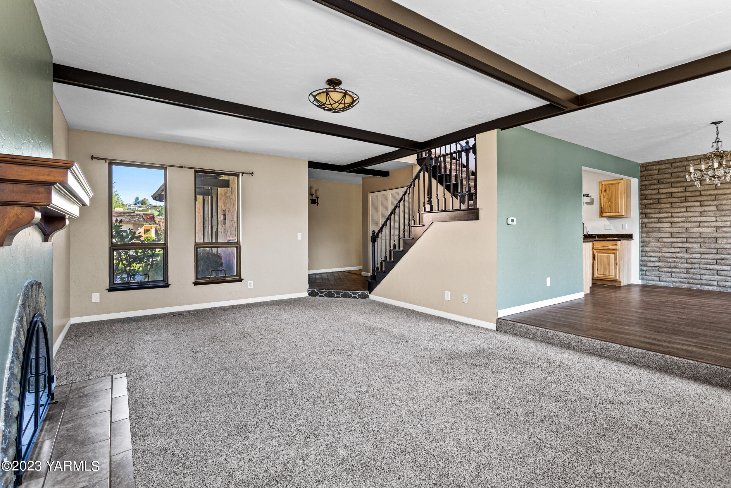 1 Crest Circle Yakima, WA 98908 - Photo 11 of 30 a view of a hallway with wooden floor and stairs