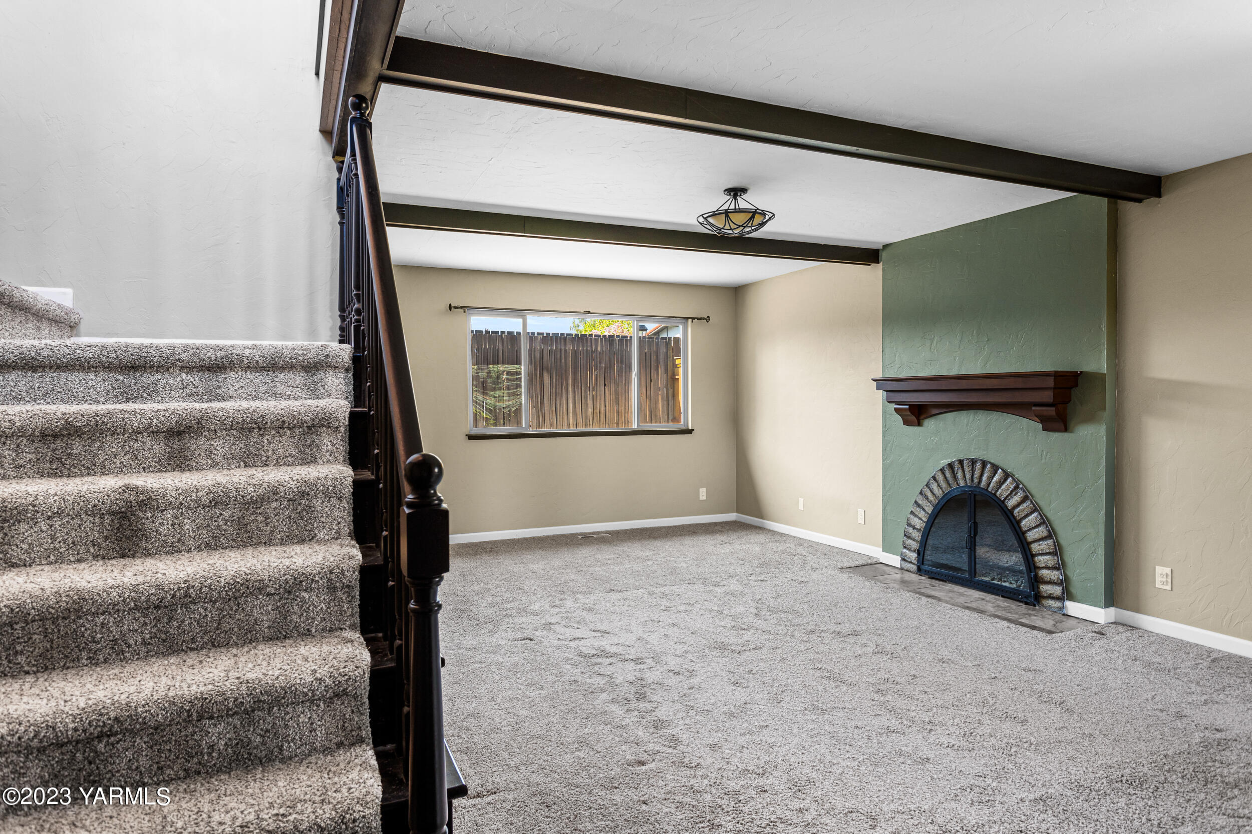 1 Crest Circle Yakima, WA 98908 - Photo 8 of 30 a view of empty room with fireplace and wooden floor