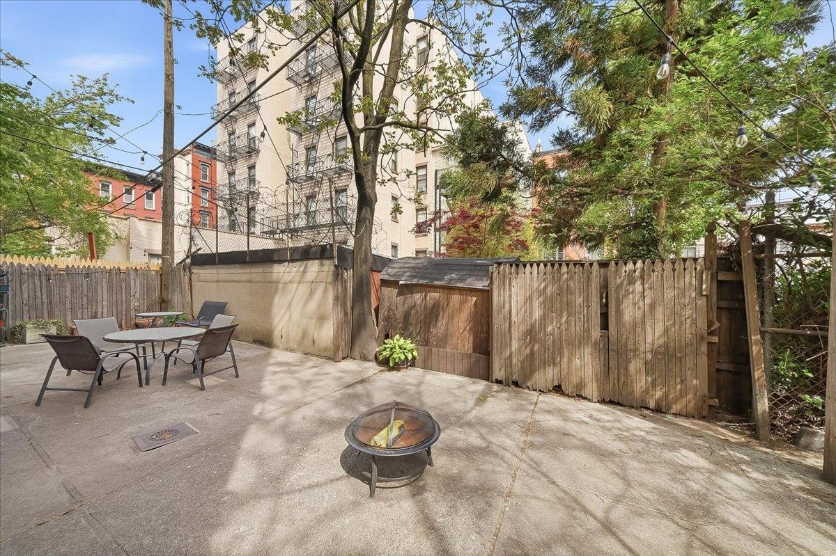 831 Clinton Street, Unit 11 Hoboken, NJ 07030 - Photo 15 of 21 a patio with table and chairs