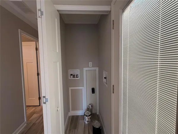 a view of a backyard with a garden and trees