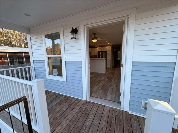 a backyard of a house with wooden fence
