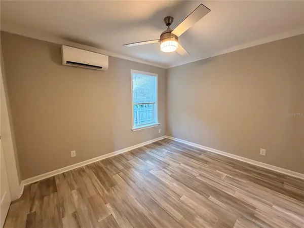 a view of an entryway with wooden floor