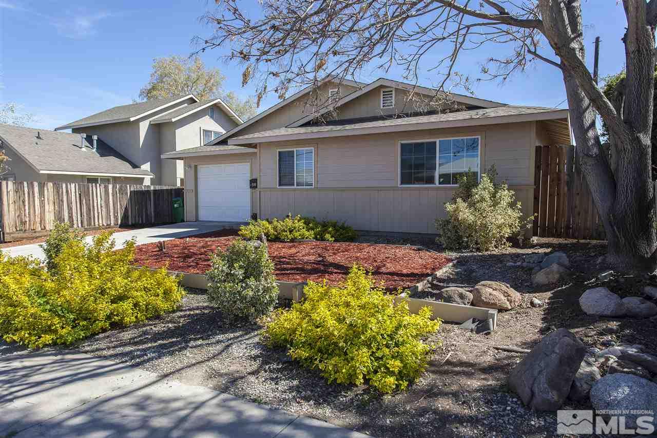 840 Roberts Street Reno, NV 89502 - Photo 1 of 25 a front view of a house with a yard