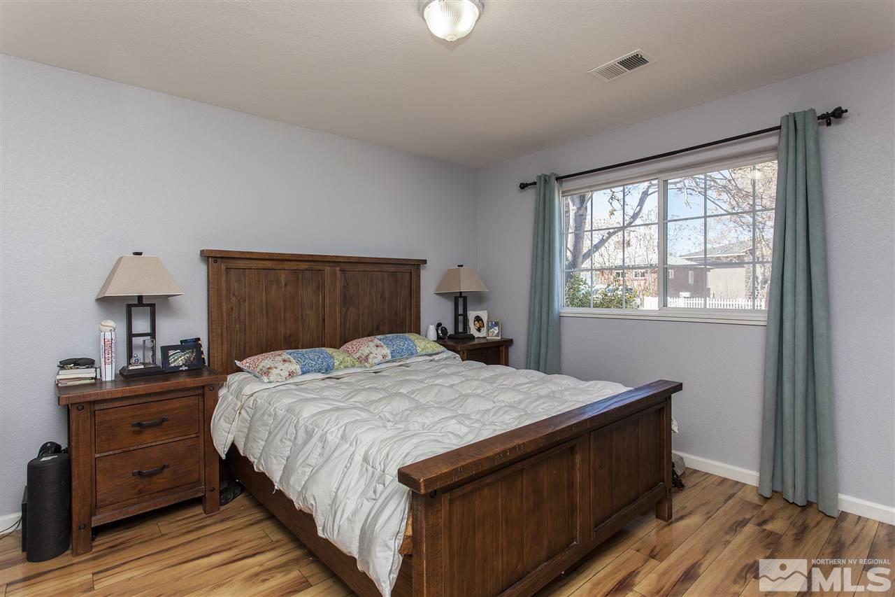 840 Roberts Street Reno, NV 89502 - Photo 14 of 25 a bedroom with a bed and a window