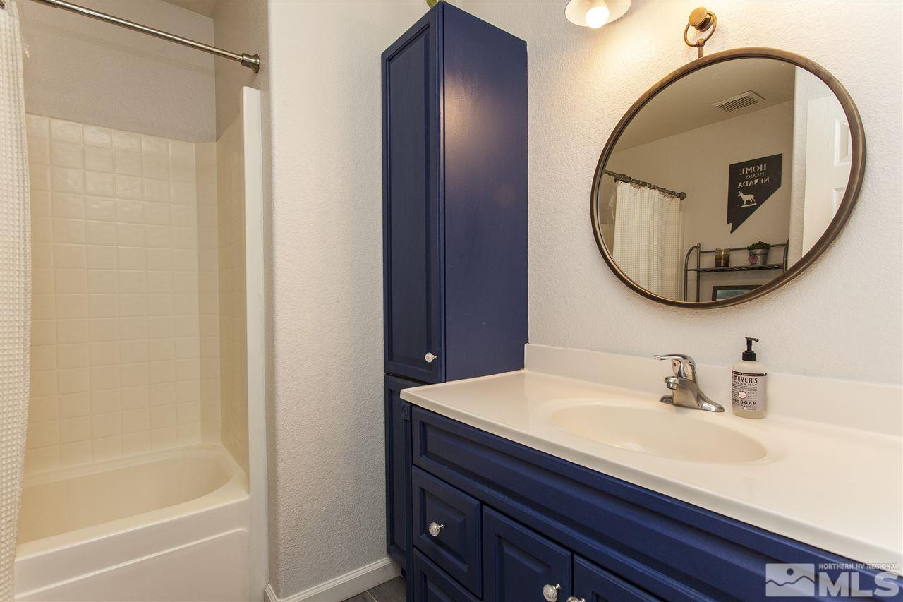840 Roberts Street Reno, NV 89502 - Photo 16 of 25 a bathroom with a sink and a mirror