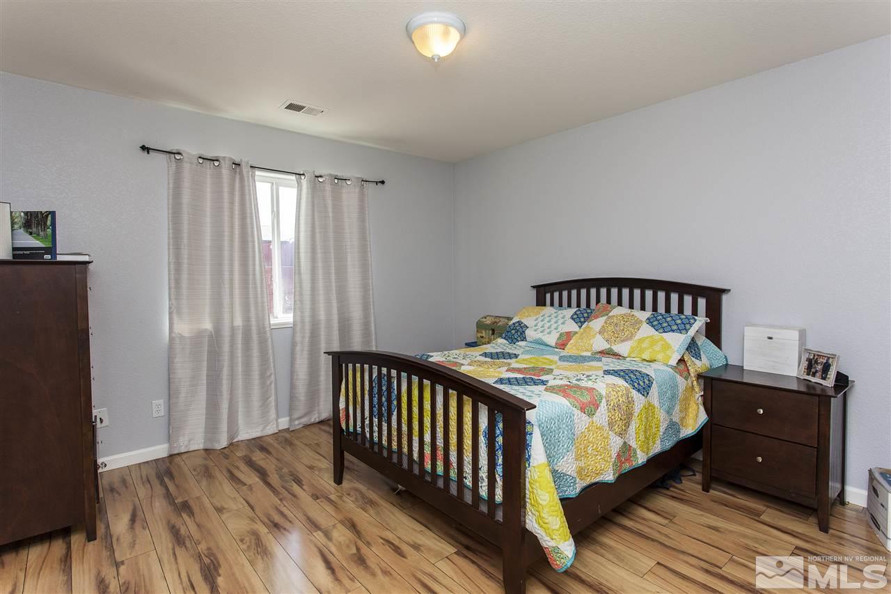 840 Roberts Street Reno, NV 89502 - Photo 17 of 25 a bedroom with a bed and a window