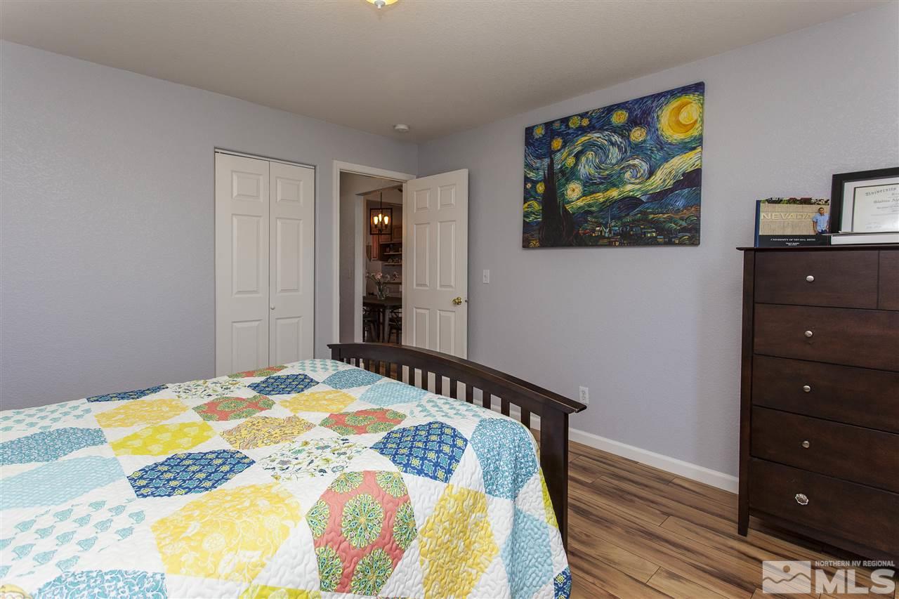 840 Roberts Street Reno, NV 89502 - Photo 18 of 25 a bedroom with a bed and a cabinet
