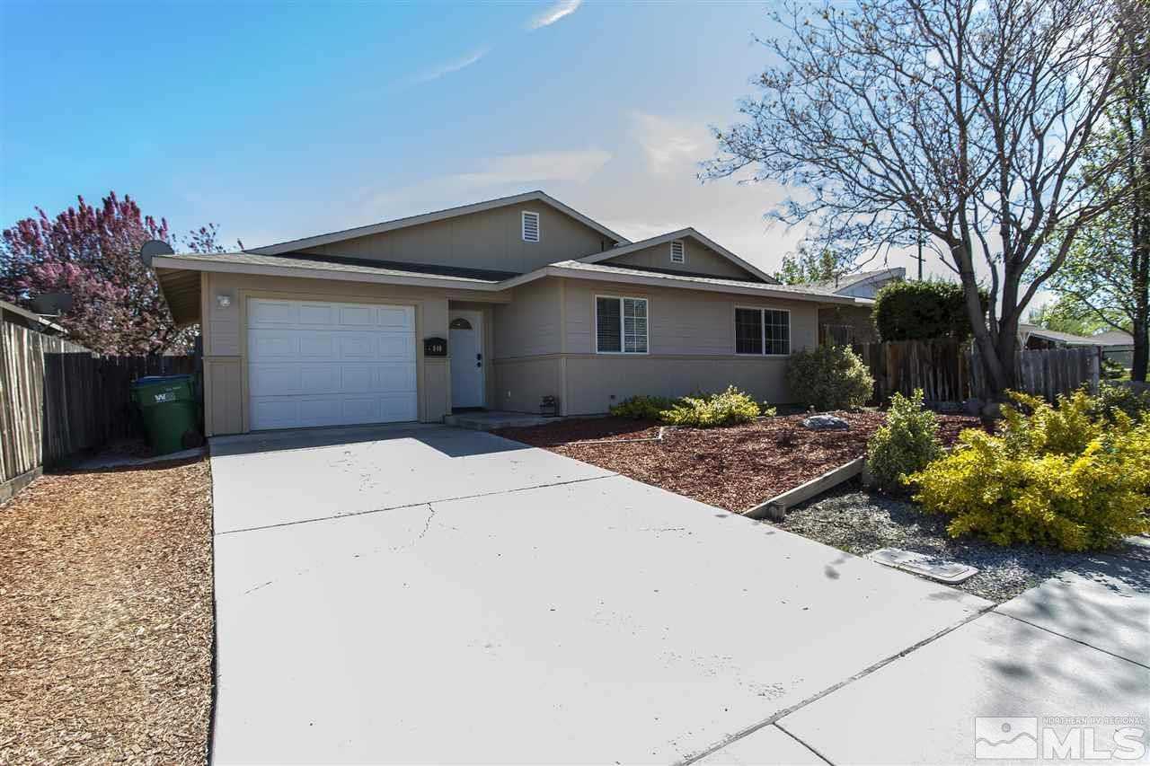 840 Roberts Street Reno, NV 89502 - Photo 2 of 25 a front view of a house with a yard and a garage