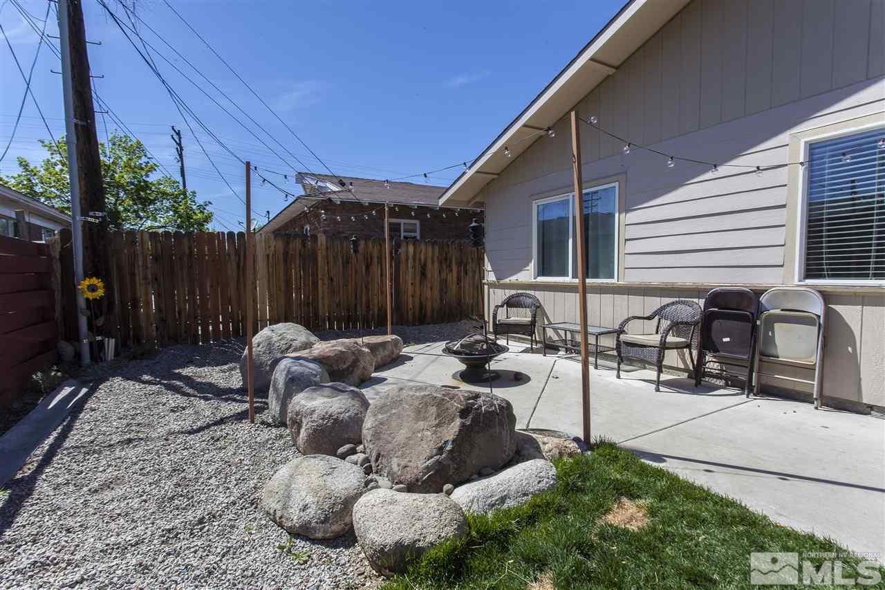840 Roberts Street Reno, NV 89502 - Photo 21 of 25 a backyard of a house with yard fire pit and outdoor seating
