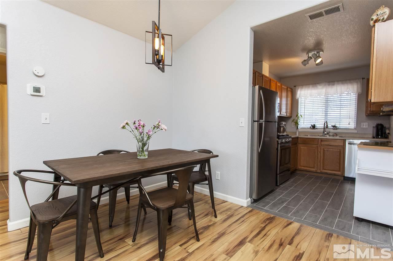 840 Roberts Street Reno, NV 89502 - Photo 8 of 25 a view of a dining room with furniture and wooden floor