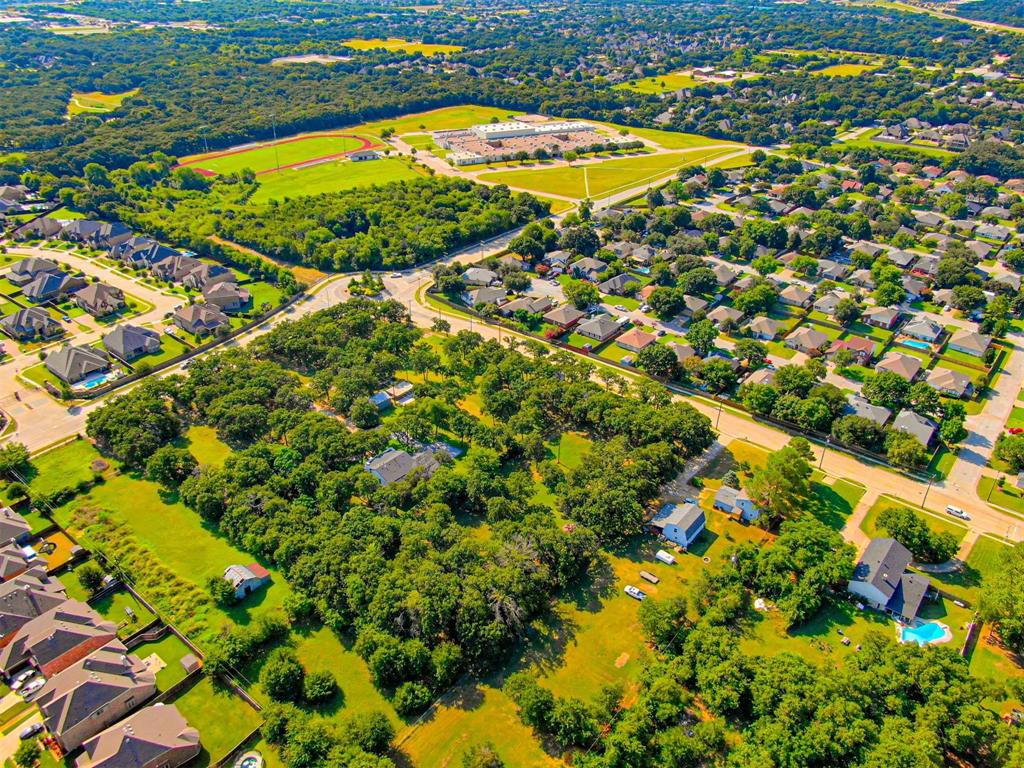 2801 Russell Road Arlington, TX 76001 - Photo 26 of 26 a view of a swimming pool with an outdoor space and seating area
