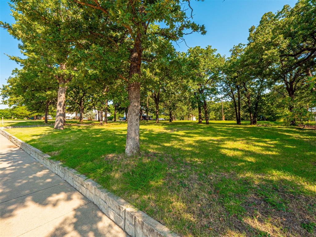 2801 Russell Road Arlington, TX 76001 - Photo 3 of 26 a huge green field with lots of trees