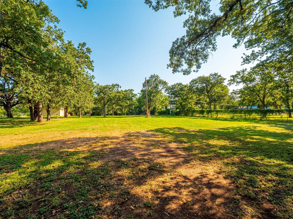 2801 Russell Road Arlington, TX 76001 - Photo 4 of 26 a view of a swimming pool and an outdoor space
