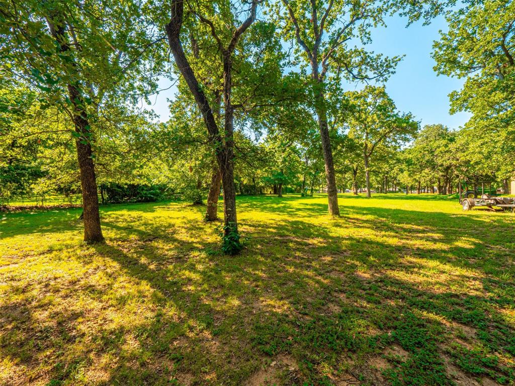 2801 Russell Road Arlington, TX 76001 - Photo 5 of 26 a view of an ocean with trees