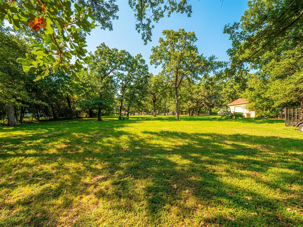 2801 Russell Road Arlington, TX 76001 - Photo 6 of 26 a view of outdoor space with yard and green space