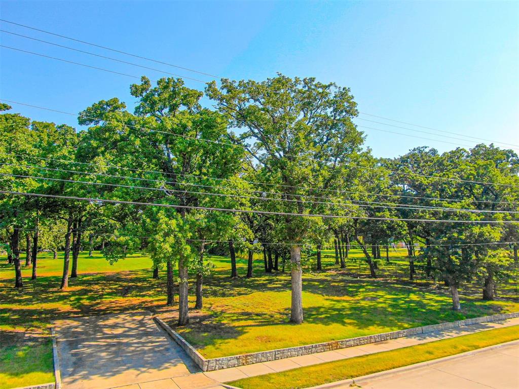 2801 Russell Road Arlington, TX 76001 - Photo 9 of 26 a view of a fountain in front of a house