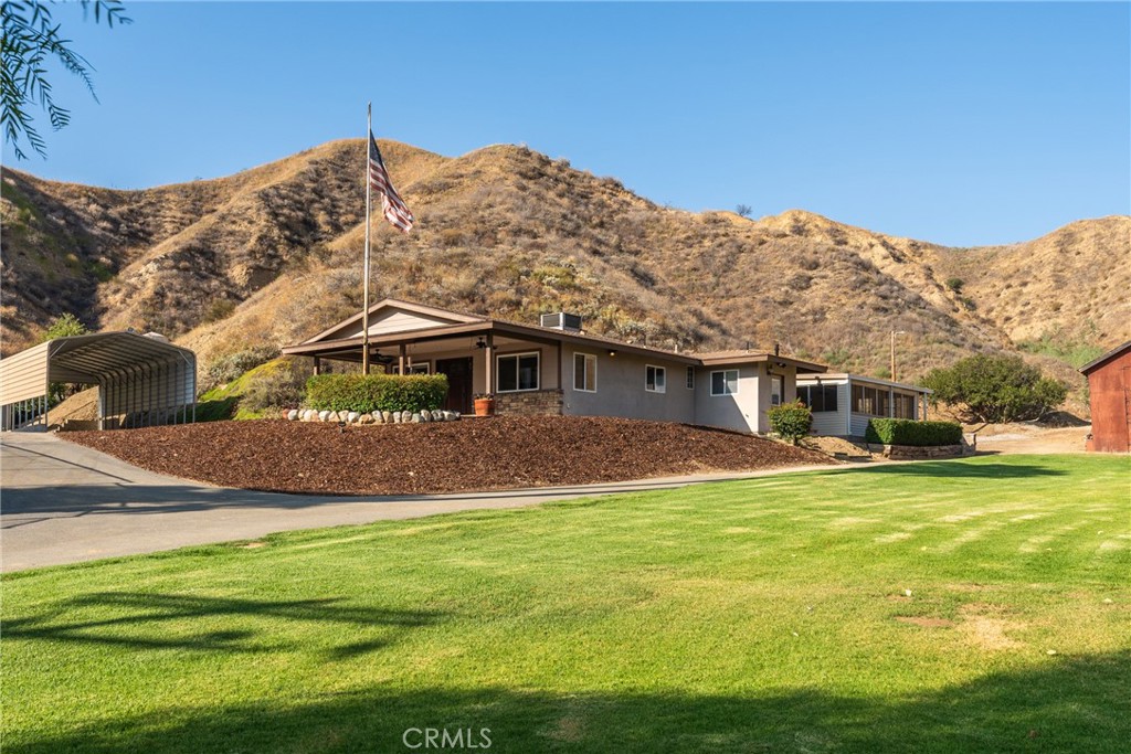 30300 Live Oak Canyon Road Redlands, CA 92373 - Photo 37 of 67 a front view of a house with a yard