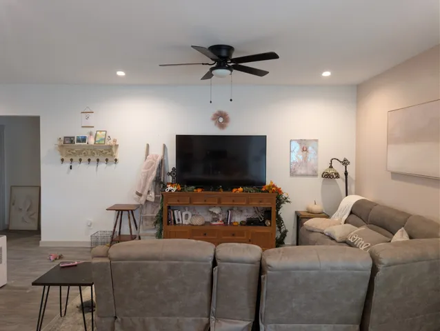 a living room with furniture and a flat screen tv