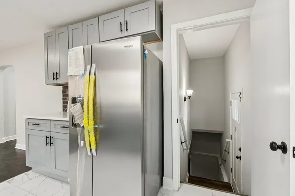 a bathroom with a shower and a mirror