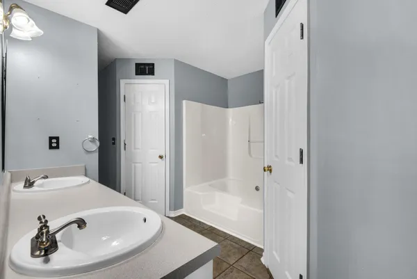 a bathroom with a sink and a tub
