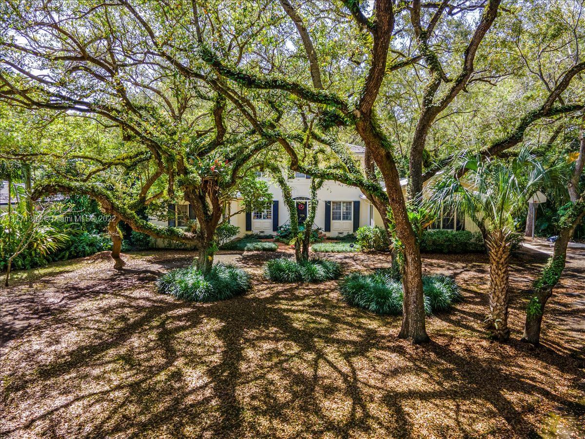 a view of a backyard with sitting area
