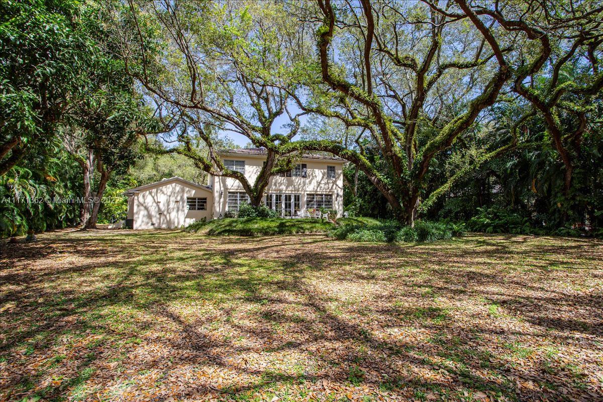 4690 Southwest 74th Street Miami, FL 33143 - Photo 2 of 8 a front view of a house with a yard