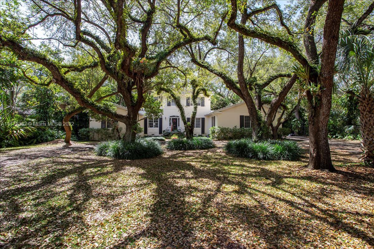 4690 Southwest 74th Street Miami, FL 33143 - Photo 7 of 8 a view of a house with a tree in the background