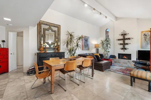 a view of a livingroom with furniture and a window