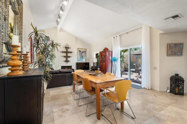 a dining room with a table and chairs