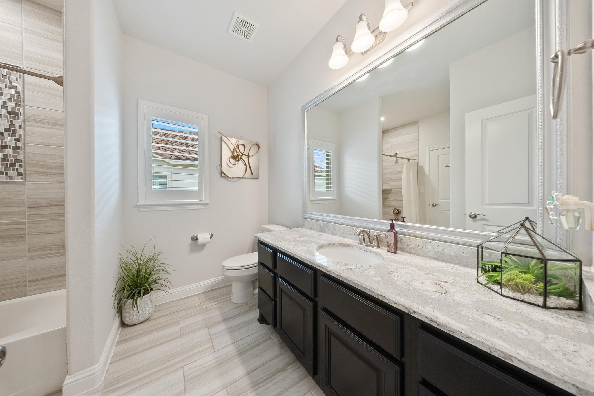 5403 Rouchel Brook Lane Sugar Land, TX 77479 - Photo 27 of 42 Private en-suite bath with extended vanity space, updated finishes, and a clean modern look.