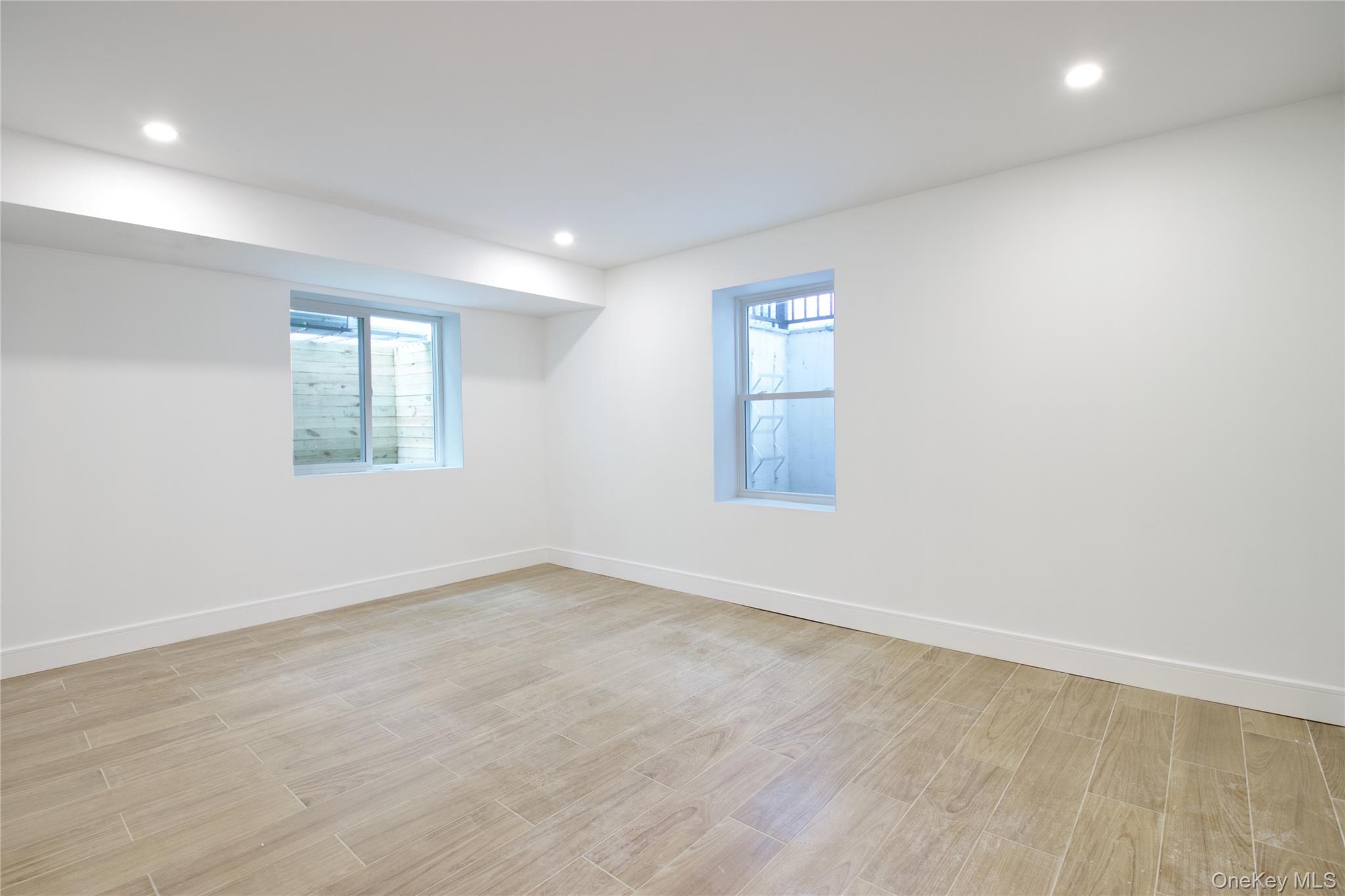 30 Kirkwood Road, Unit B Port Washington, NY 11050 - Photo 34 of 36 an empty room with a window