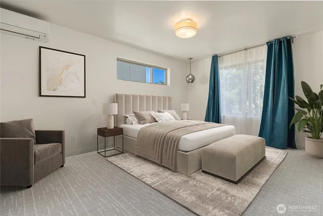 a bedroom with a bed and a couch