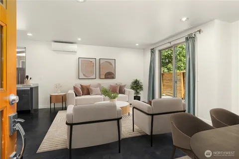 a living room with furniture and a window