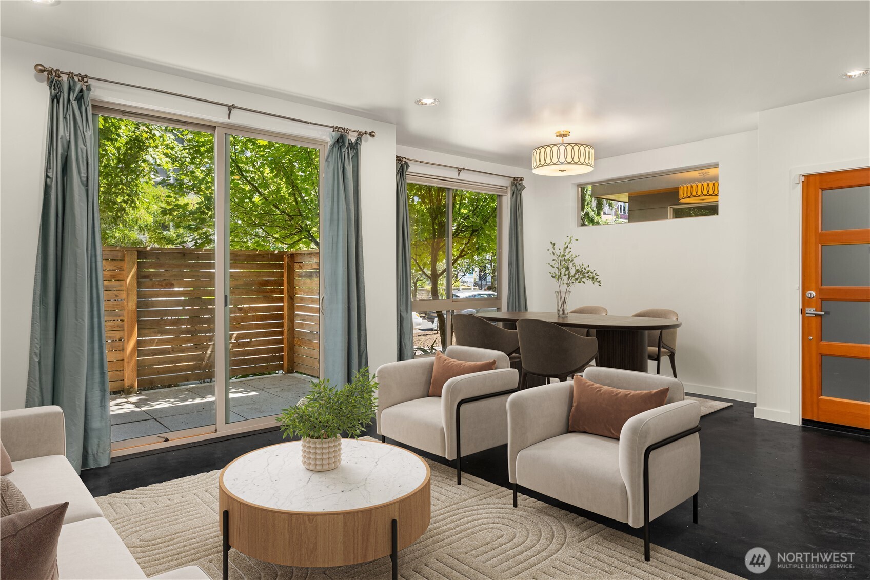 933 16th Avenue, Unit A Seattle, WA 98122 - Photo 8 of 19 a living room with furniture and a large window