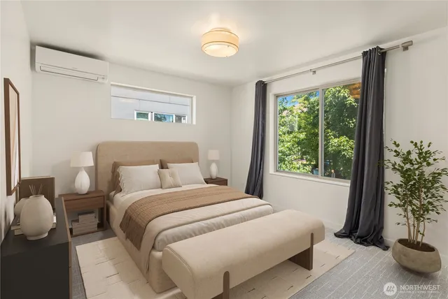 a bedroom with a bed and a potted plant