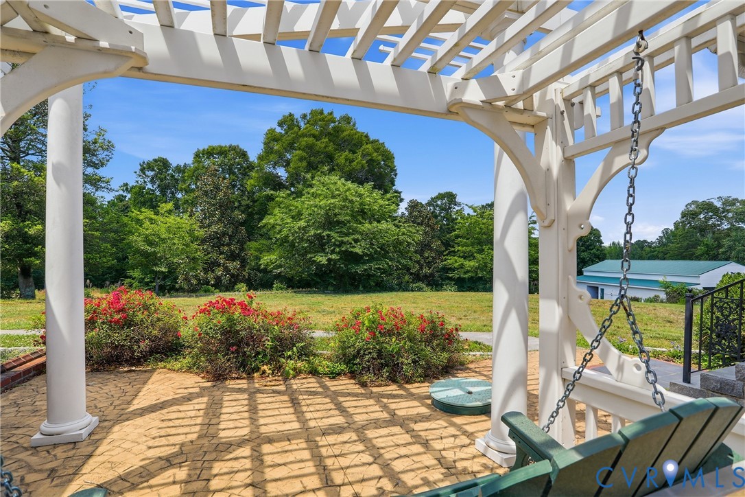 13300 West Patrick Henry Road Doswell, VA 23047 - Photo 51 of 69 Expansive outdoor patio featuring a white pergola,