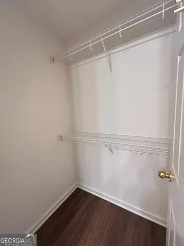 a view of a room with empty racks on the wall