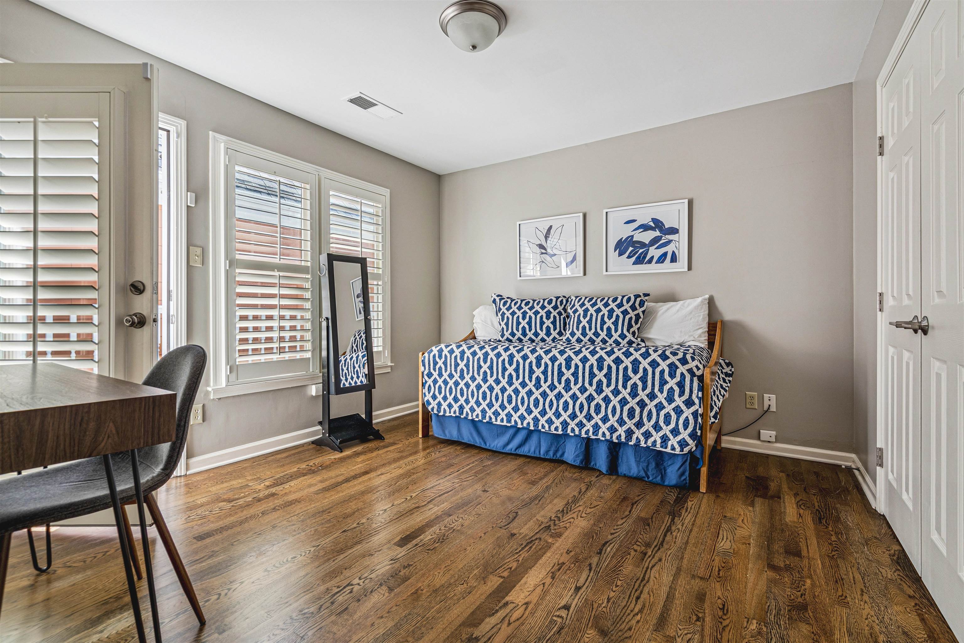 942 Harbor Bend Road Memphis, TN 38103 - Photo 19 of 25 a bedroom with a bed and wooden floor