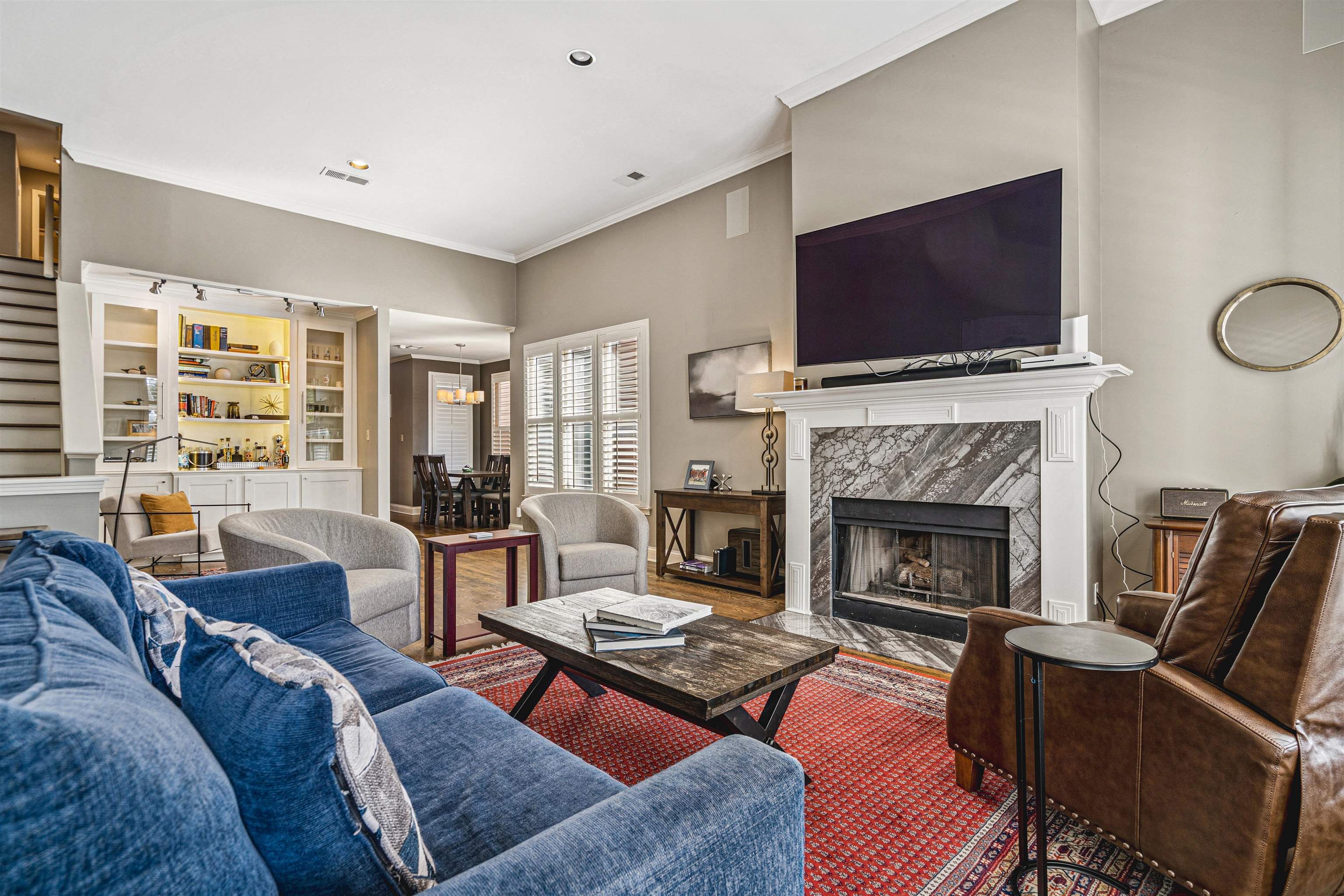 942 Harbor Bend Road Memphis, TN 38103 - Photo 5 of 25 a living room with furniture a flat screen tv and a fireplace