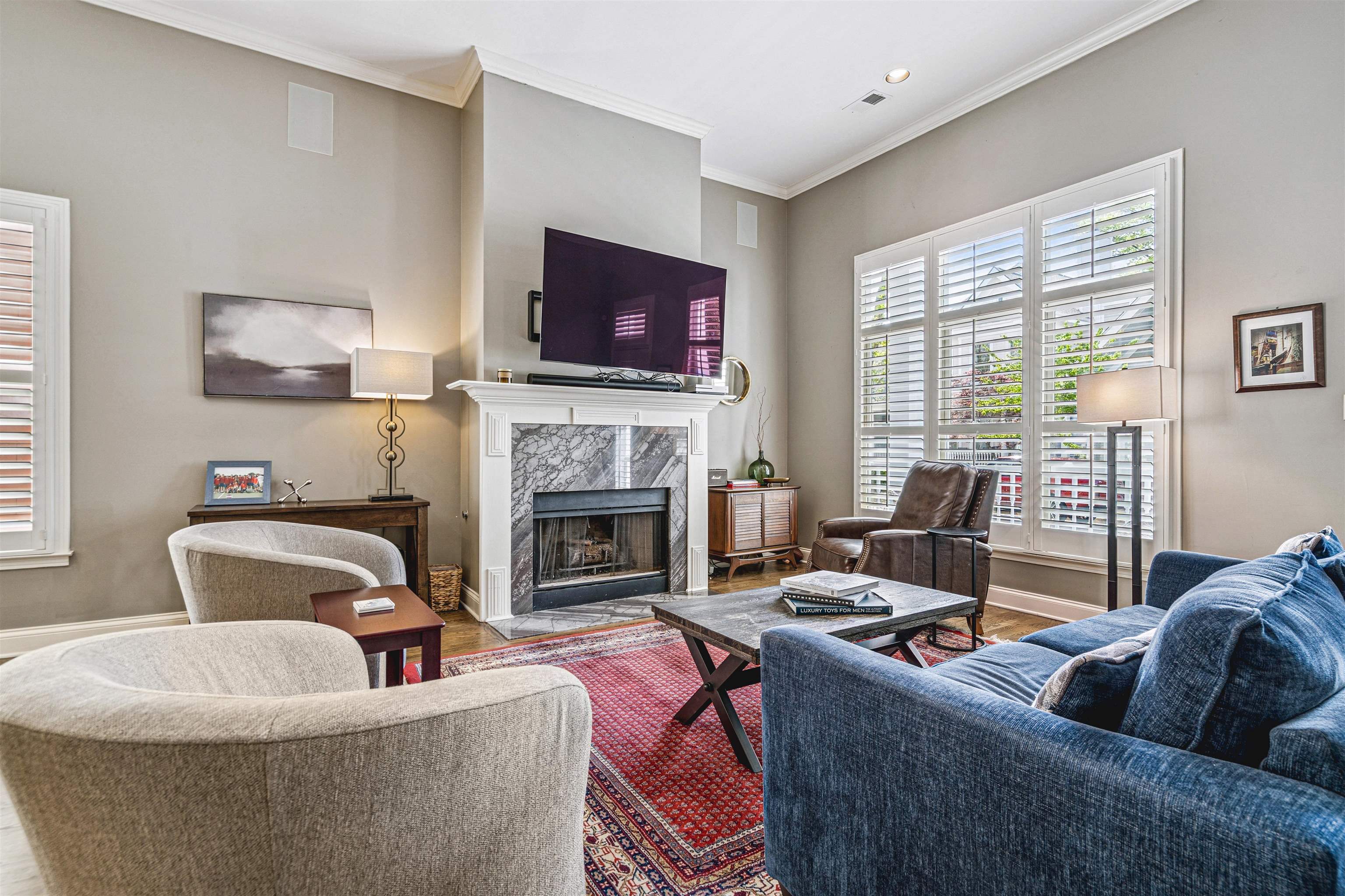 942 Harbor Bend Road Memphis, TN 38103 - Photo 6 of 25 a living room with furniture a flat screen tv and a fireplace