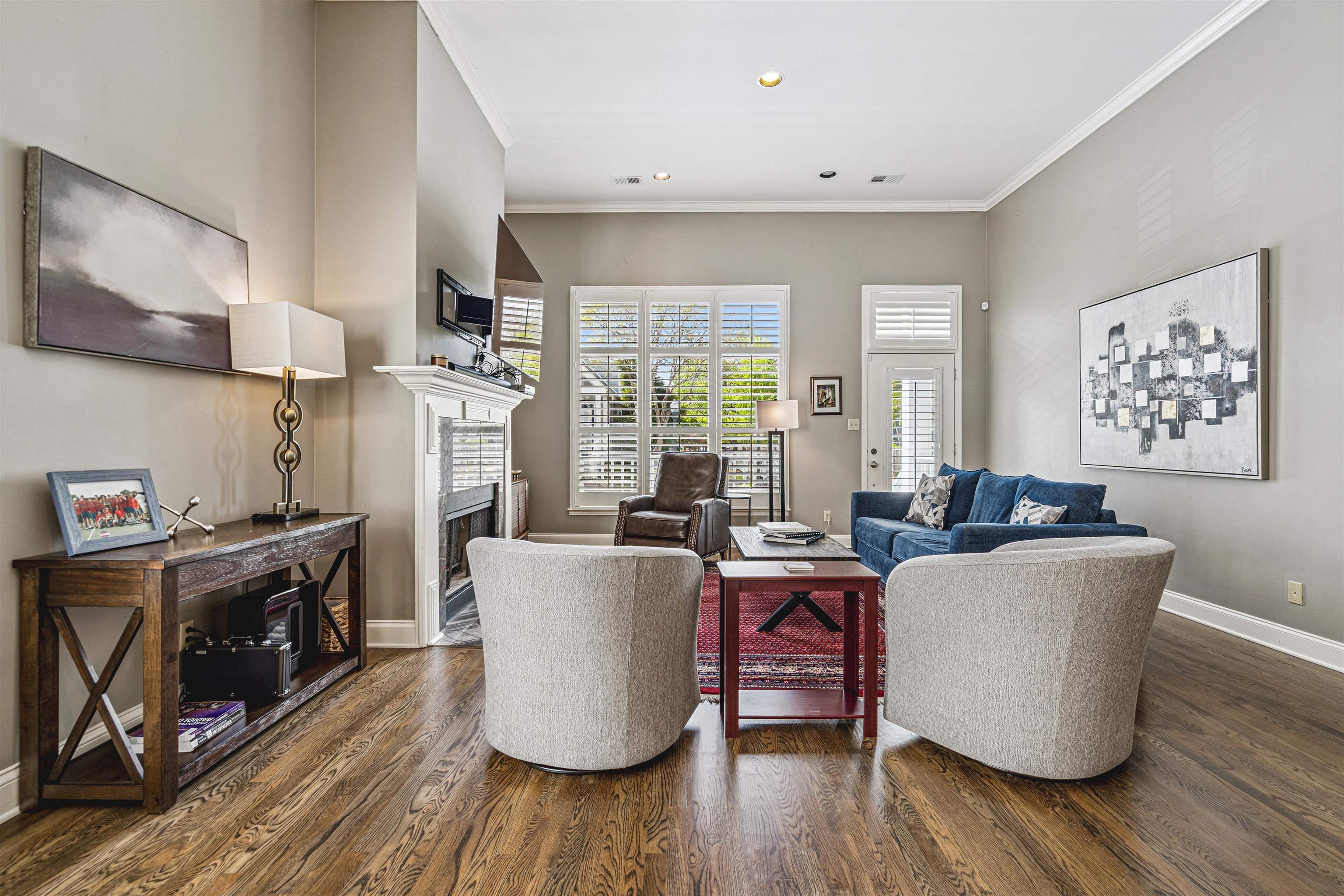 942 Harbor Bend Road Memphis, TN 38103 - Photo 7 of 25 a living room with furniture a wooden floor and a fireplace
