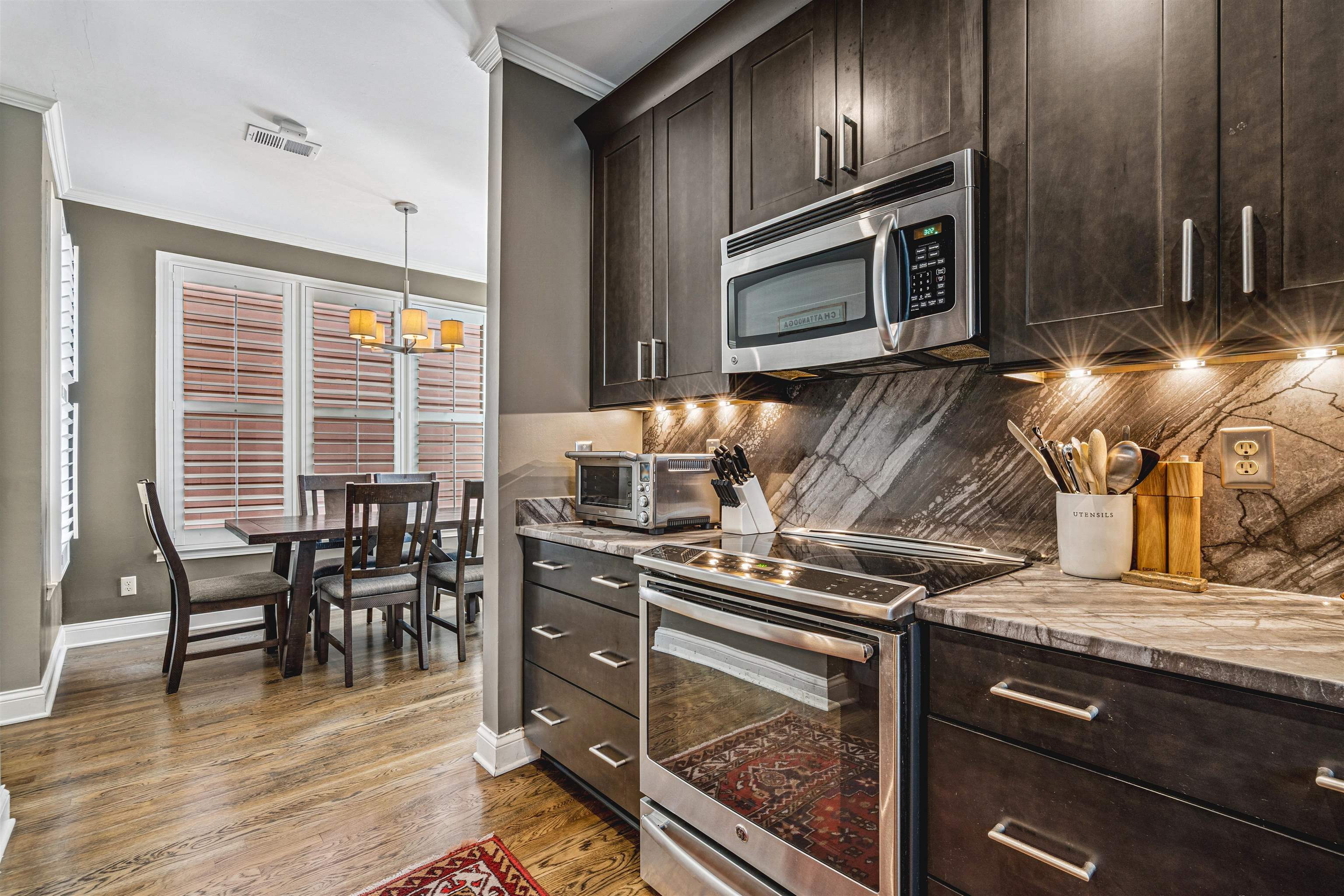 942 Harbor Bend Road Memphis, TN 38103 - Photo 10 of 25 a kitchen with a stove and a microwave