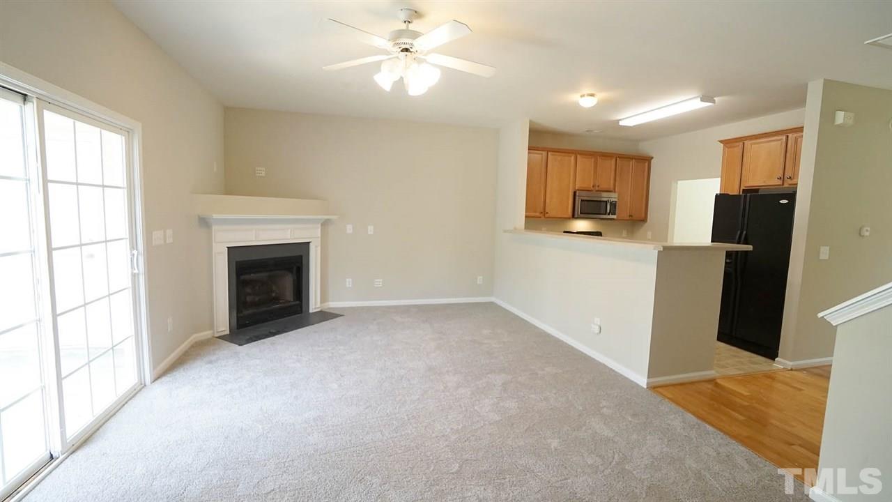 2243 Bankshill Row Raleigh, NC 27614 - Photo 8 of 22 Family Room with Fireplace and access to the Screened in Porch