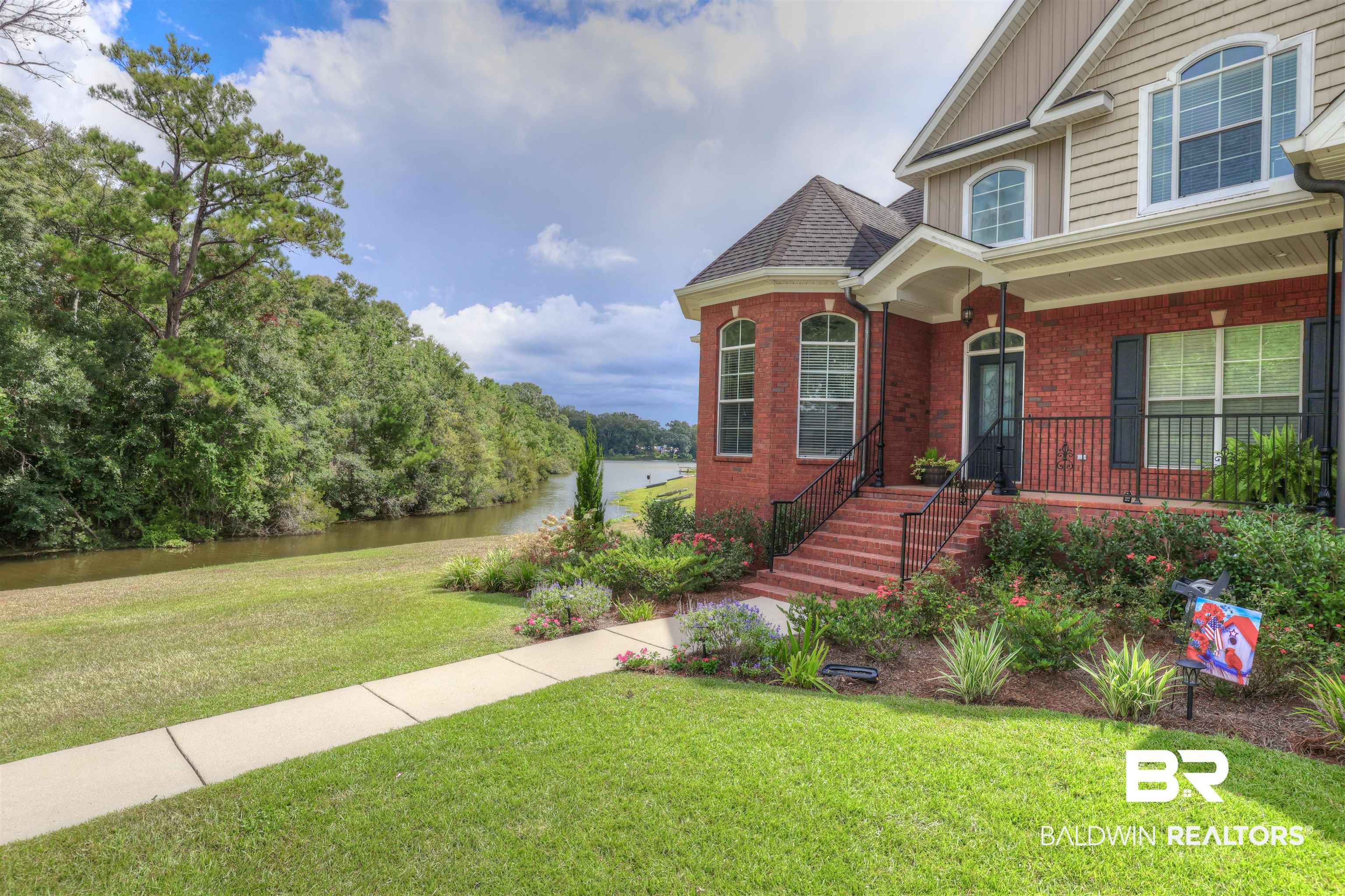 5565 Dawes Lane Theodore, AL 36582 - Photo 36 of 38 View of front of property featuring a front yard and a water view