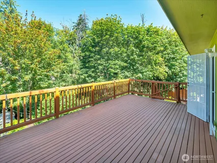 a balcony with wooden floor