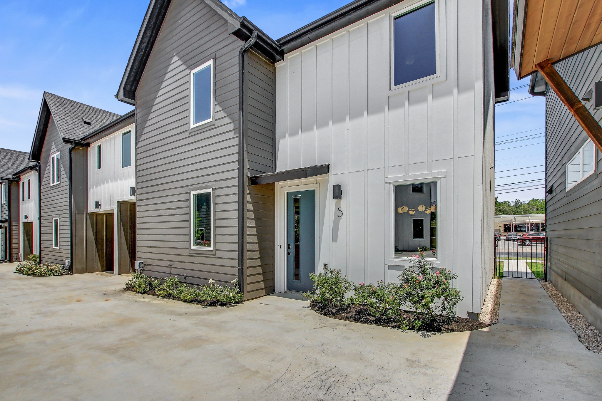 4127 East 12th Street, Unit 5 Austin, TX 78721 - Photo 27 of 33 Multi unit property with board and batten siding and a patio