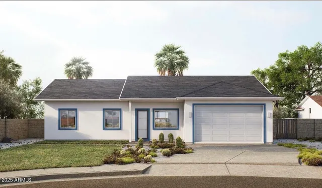 a front view of a house with a garden